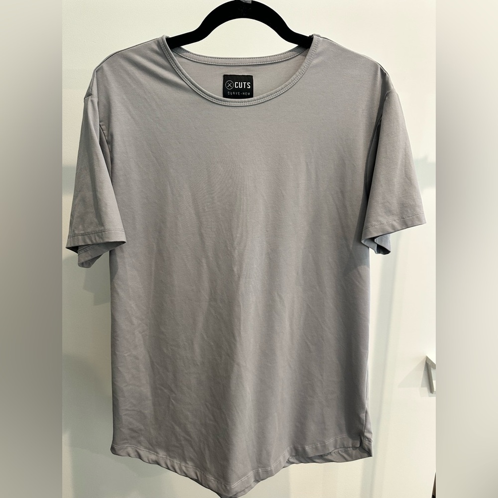 Dak Prescott Owned CUTS Curved- Hem Tee-
Grey- Men’s XL
